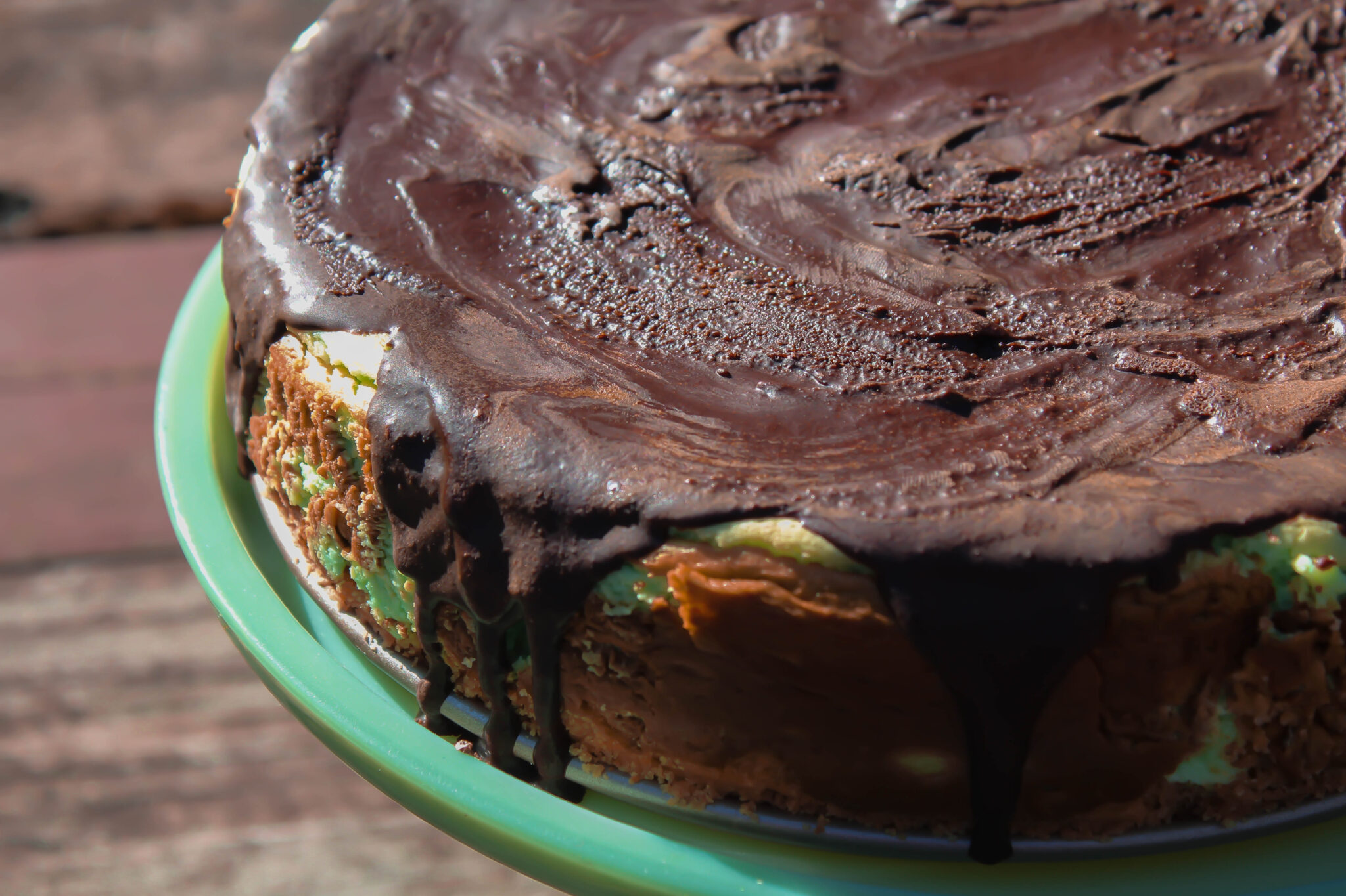 My Shamrock Cheesecake is the perfect way to celebrate St. Patrick's Day! A minty cheesecake with a delectable chocolate topping. What could be better?