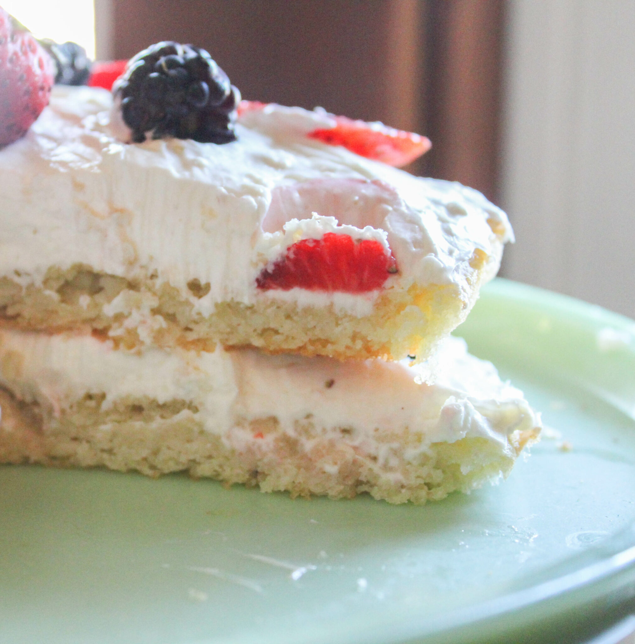 My Berries and Cream Cake is not only delicious but beautiful! It has two decadent layers stuffed with a cream cheese icing and berries! 