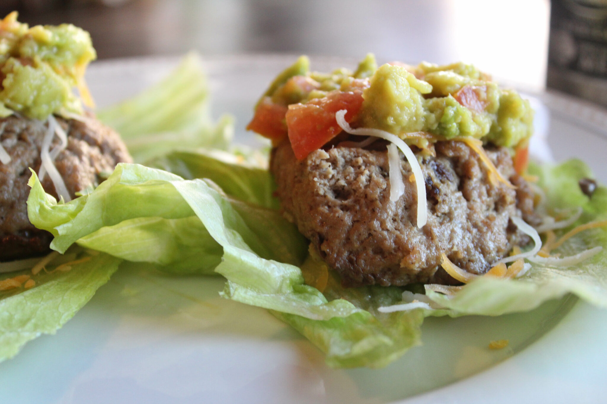 These Keto Low Carb Turkey Burgers are a great light lunch or dinner. They're so flavorful and juicy and they have a delicious avocado topping.